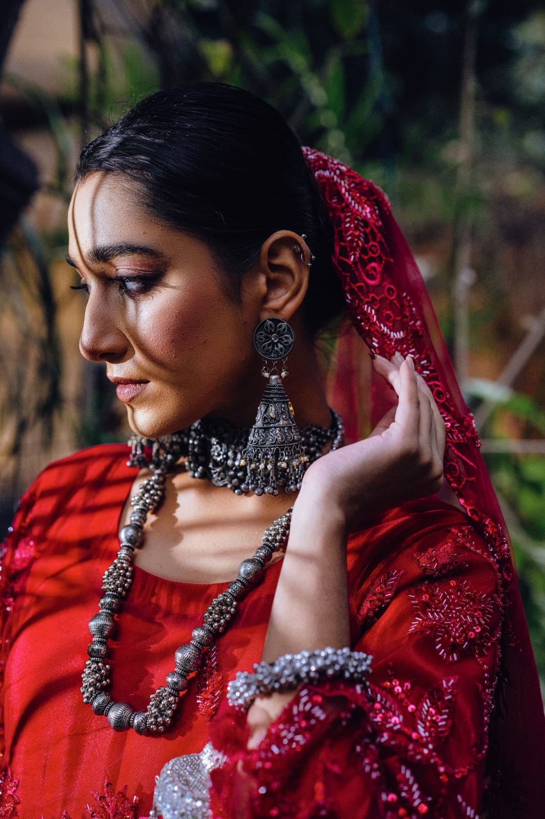 Wearing jhumkas and a mala brings her joy as she adorns herself.