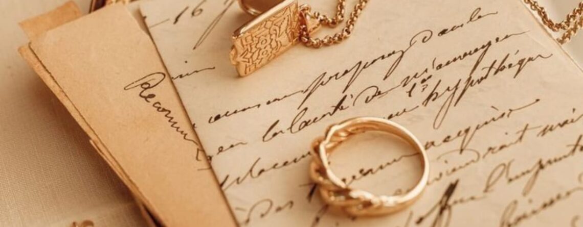 Golden ring with a Necklace on Piece of paper